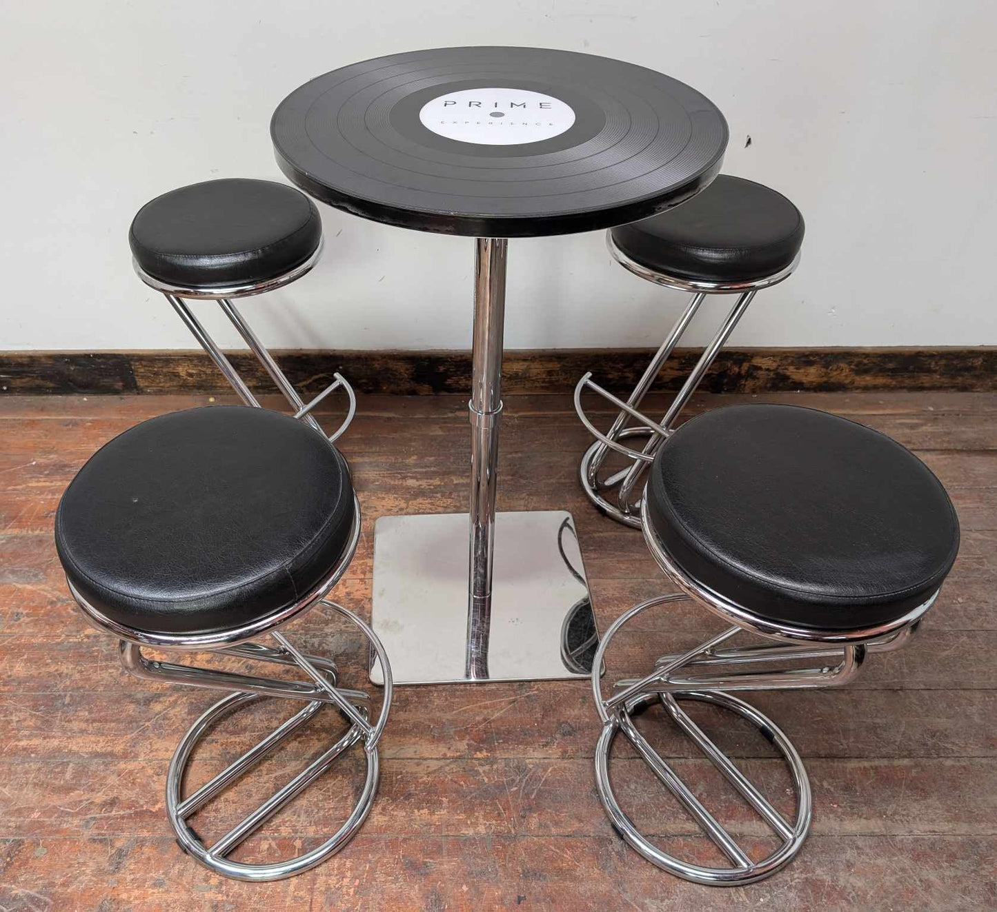 Black Poseur Table with Record Disc Design and Four Stools