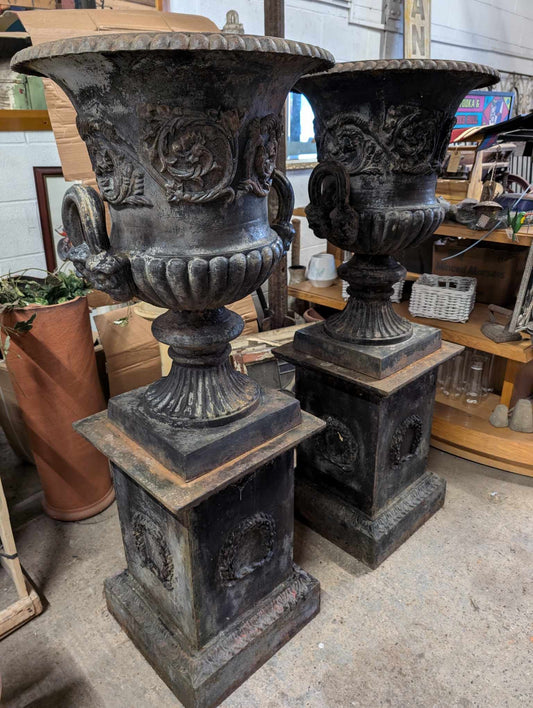 Pair of Cast Iron Urn Planters on Pillar Plinths