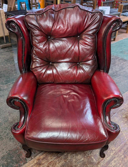 Oxblood Red Leather Wingback Armchair with Brass Beading