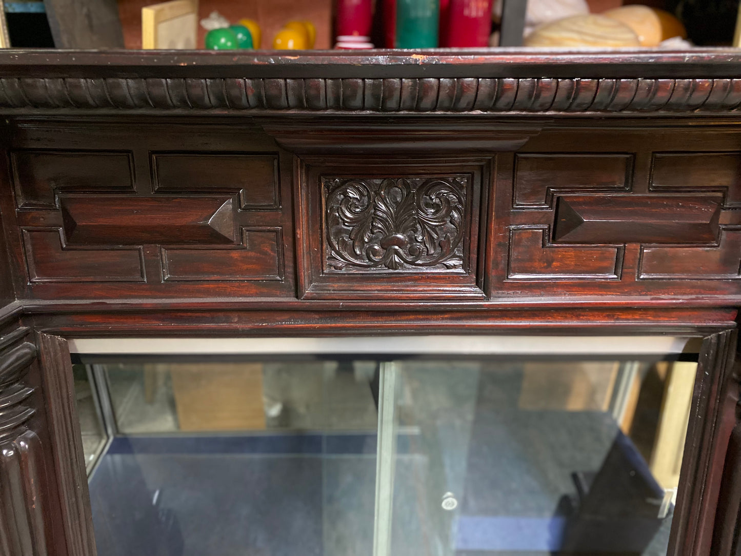 Ornate fire surround in dark wood