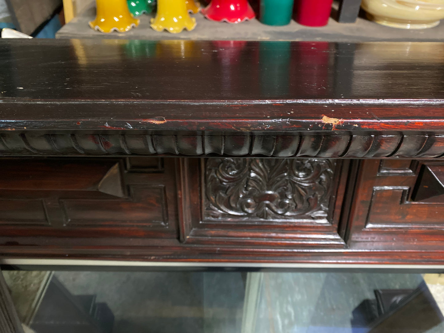 Ornate fire surround in dark wood