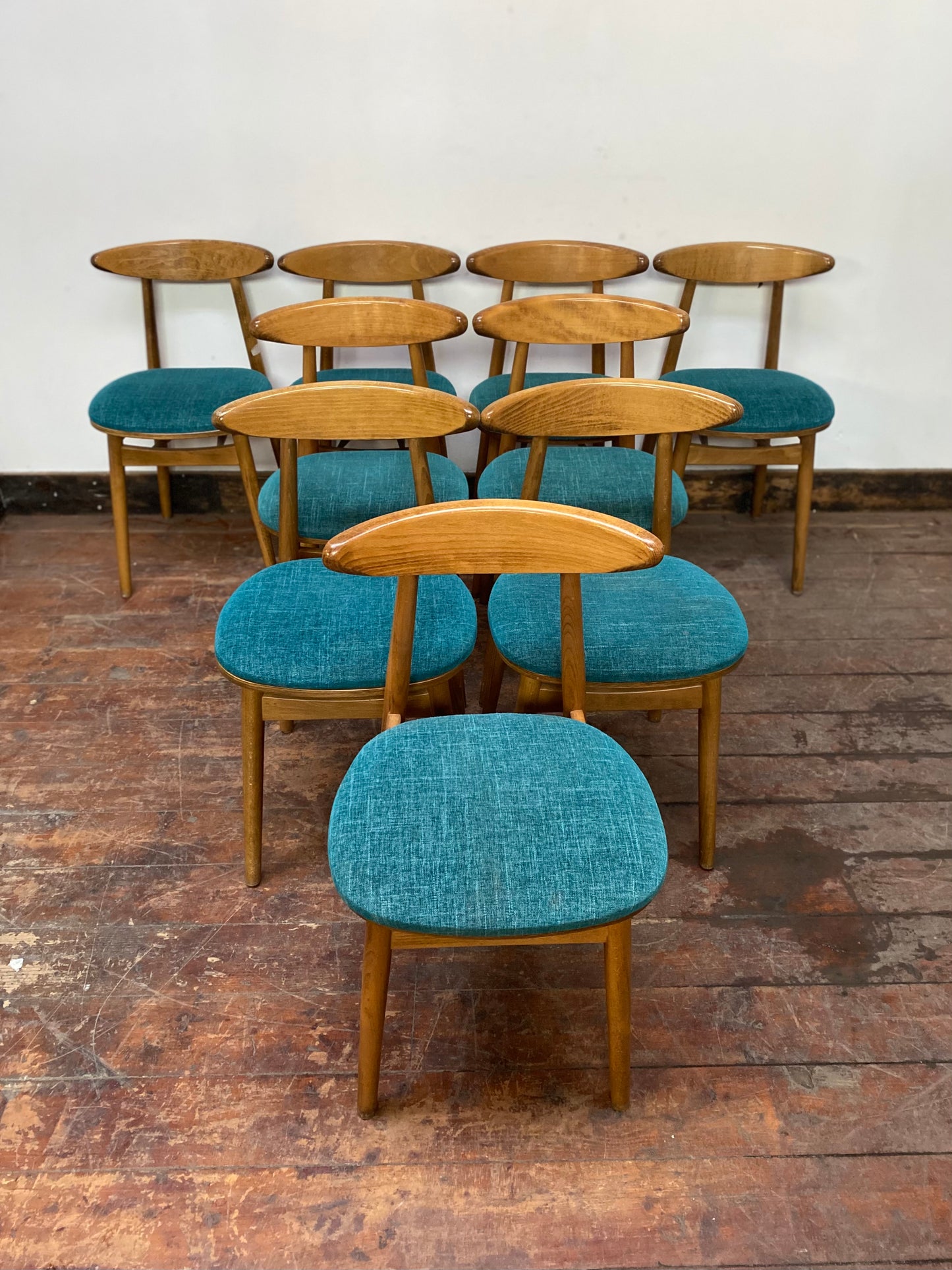 9 curved wooden dining chairs with turquoise seats