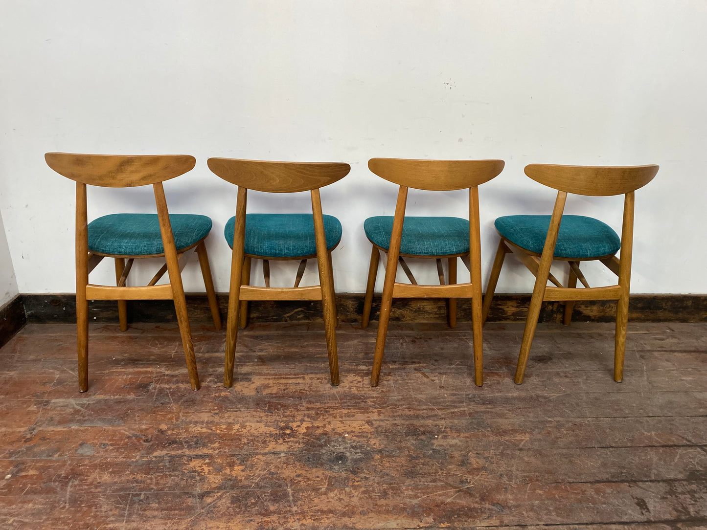 9 curved wooden dining chairs with turquoise seats