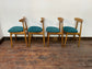 9 curved wooden dining chairs with turquoise seats