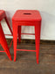 4 red metal stools