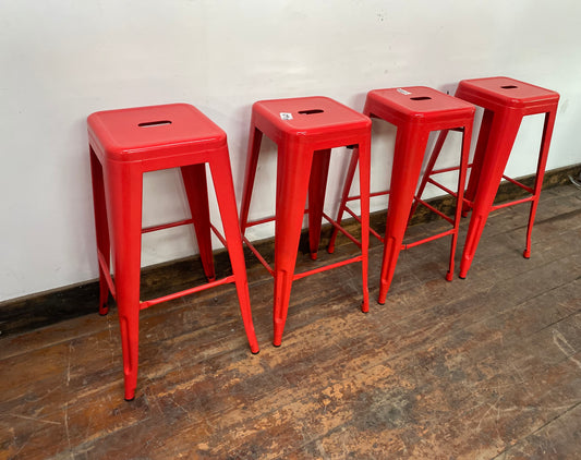 4 red metal stools